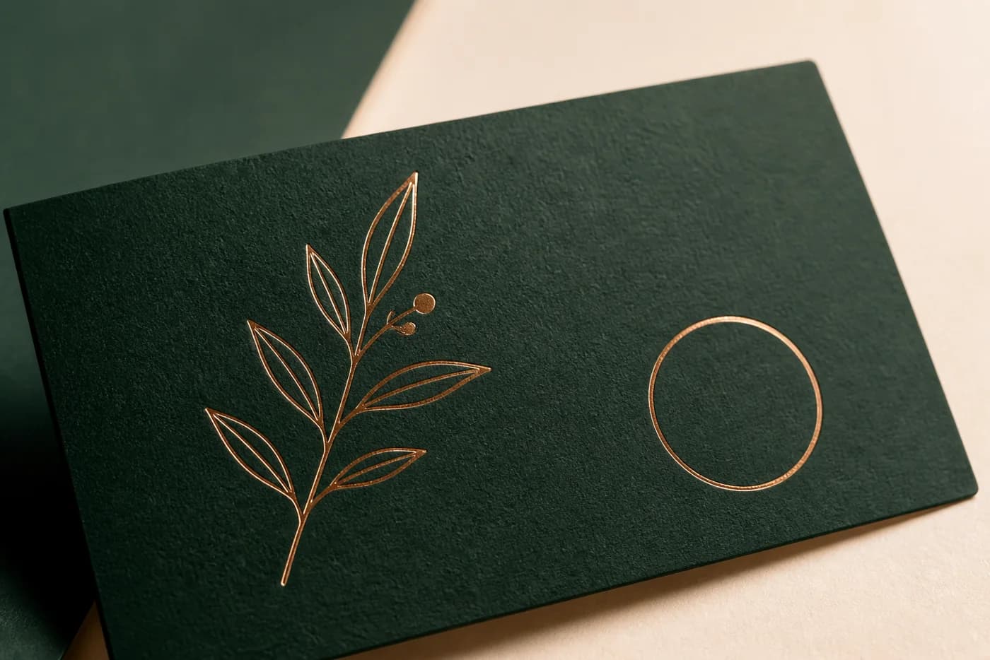 Copper foil stamping on dark green specialty paper